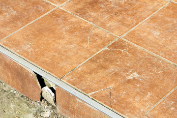 closeup of a  cracked tiles