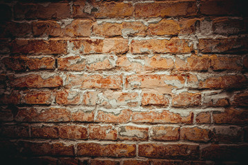 Weathered texture of stained old dark brown and red brick wall background