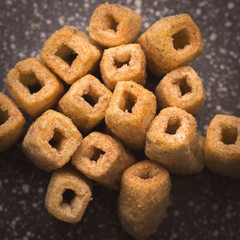 Chips of wheat flour in the form of tubes. Close-up. Top view