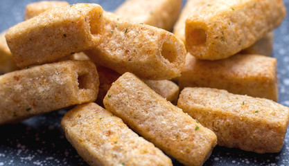 Chips of wheat flour in the form of tubes. Close-up