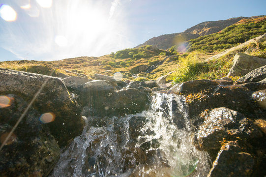 Natural Steam in the swiss alps with sun