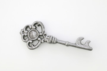 Decorative antique key isolated in white background