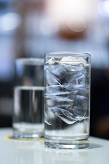 Blue color tone of Drinking water and blurred background.