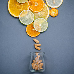 Healthy foods and medicine concept. Bottle of vitamin C and vari