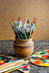 Brushes and paint on the table