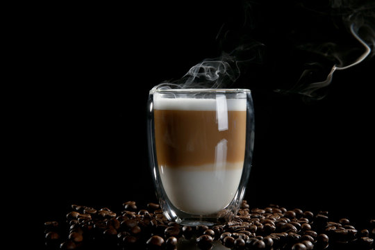 Cup of coffee with beans on black background - Powered by Adobe