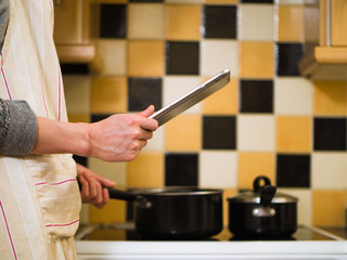using digital tablet in kitchen