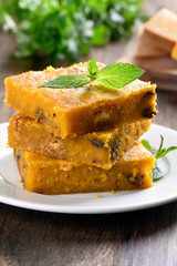 Sliced pumpkin pie with nuts