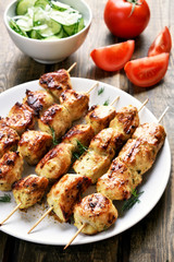 Barbecue, chicken kebab and vegetables