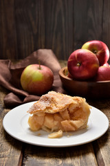 Piece of apple pie ad fresh fruits