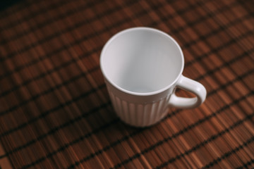 white mug, wooden napkin, makisu