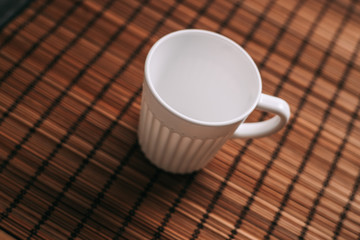white mug, wooden napkin, makisu