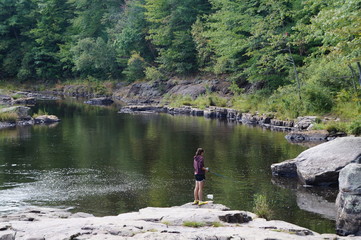 Young girl fishing at Tobyhanna Creek, Pennsylvania