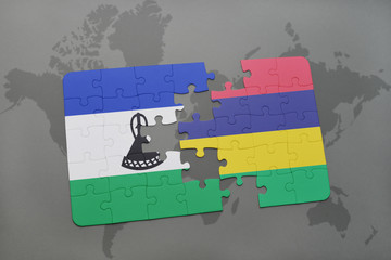 puzzle with the national flag of lesotho and mauritius on a world map