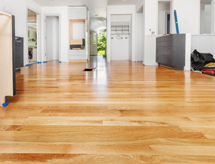 Remodeled kitchen has existing hardwood floor patched and refinished