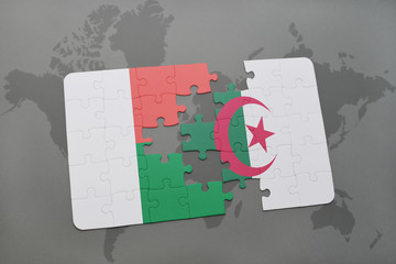 puzzle with the national flag of madagascar and algeria on a world map