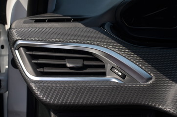 Air vent in a car interior on daylight