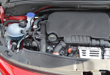 Fototapeta premium Engine of a car under opened hood