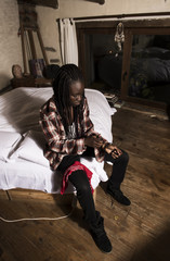 Black model lying on a bed and posing