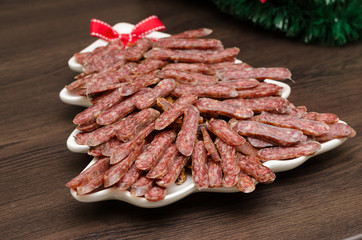 flat sausage in a white plate