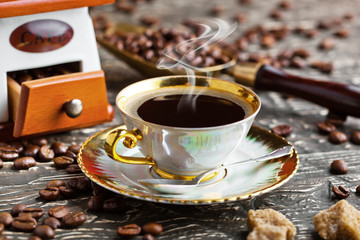 Black coffee in a cup on old background