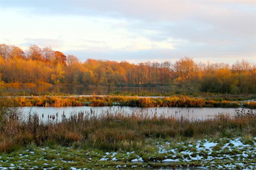 Autumn and winter snow-covered landscape