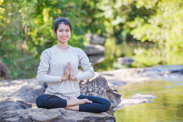 asian woman Yoga - relax in nature