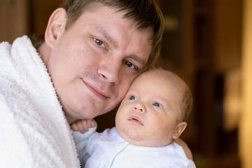 Cute newborn baby in father's hands. Stock photo