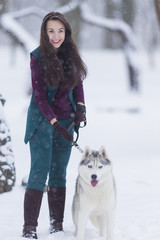 Home Pets Concept and Ideas. Happy Caucasian Brunette Woman and Husky Dog