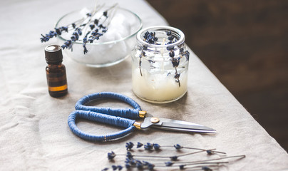 handmade candles with lavender on textile background