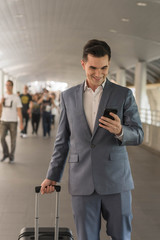 Westerner Business man talking via smart phone on the walk way w