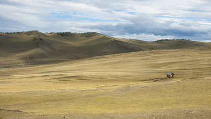 Obraz premium Hilly Steppe landscape, blue sky with clouds. in Siberian