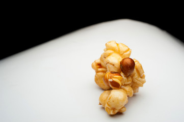 caramel popcorn on a white background