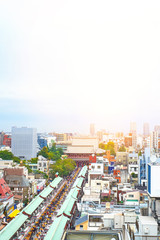 Fototapeta premium Asia Business concept for real estate and corporate construction - vertical modern cityscape building bird eye aerial view of Sensoji shrine under sunrise and morning blue bright sky in Tokyo, Japan