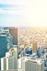 Naklejka premium Asia Business concept for real estate and corporate construction - panoramic modern cityscape building bird eye aerial view under sunrise and morning blue bright sky in Tokyo, Japan