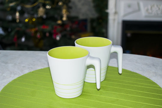 White Cup with handle for tea on Christmas background