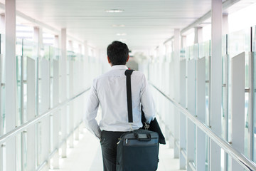 indian business male walking at airport