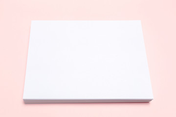 Blank paper  on top of pink pastel desk