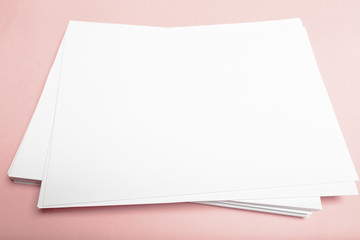 Blank paper  on top of pink pastel desk