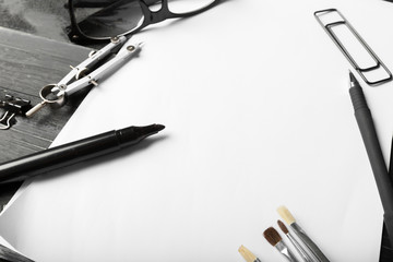 Blank notebook and pencil with glasses on wooden table