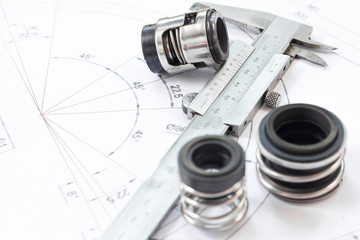 Mechanical Seals for prevent liquid leak for the industry with drawings on table working.