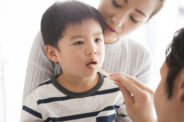 Child is under throat examination