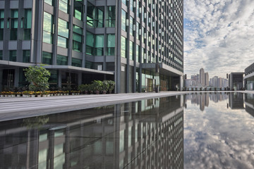 close up of modern office buildings near water
