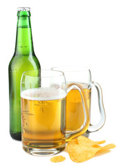 Green beer bottle with two mugs of beer on a white background isolated.