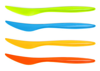 Plastic knives on a white isolated background