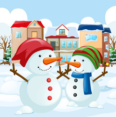 Two snowman in the field