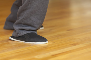 Tai Chi footwork and kung fu shoes, shallow depth of field, focus on shoe.