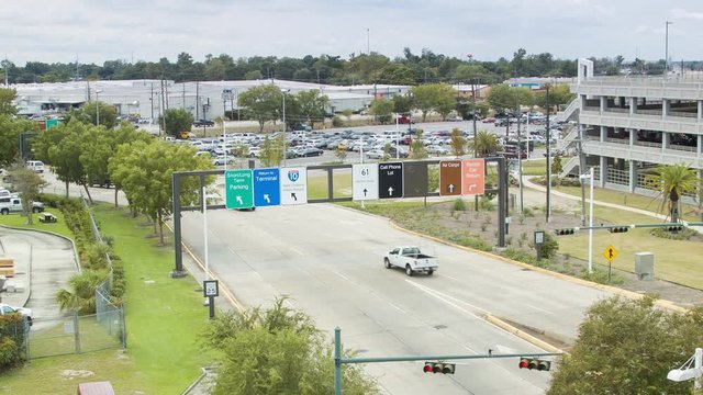 Traffic out of Louis Armstrong New Orleans International Airport MSY with Signage Directing Vehicles to Various Roads and Options Including Interstate 10 to the City