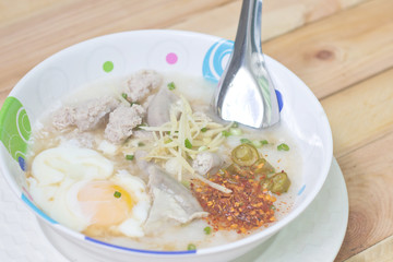 Traditional chinese porridge rice gruel in bowl.