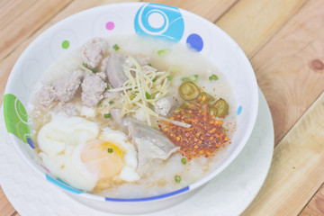 Traditional chinese porridge rice gruel in bowl.